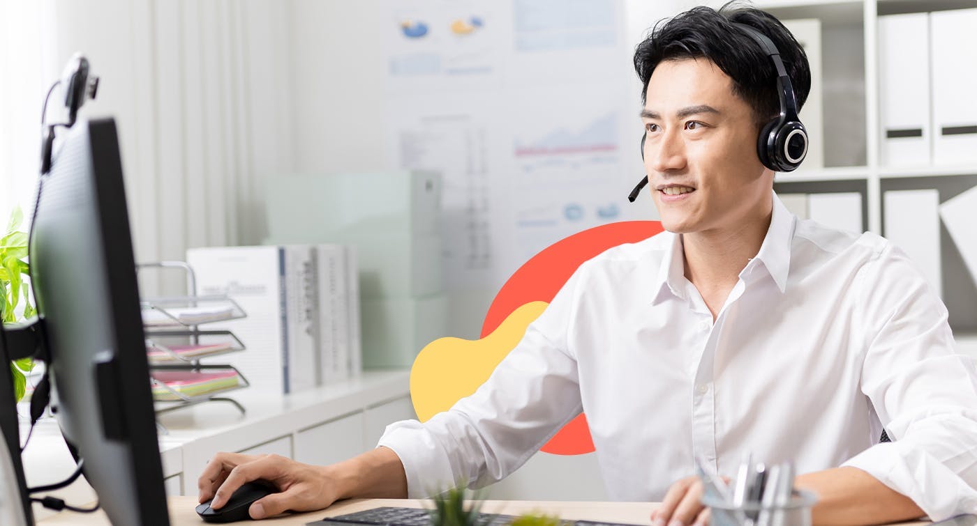 Man at a computer wearing a headset, representing a contractor who a business would need to submit a TPAR for