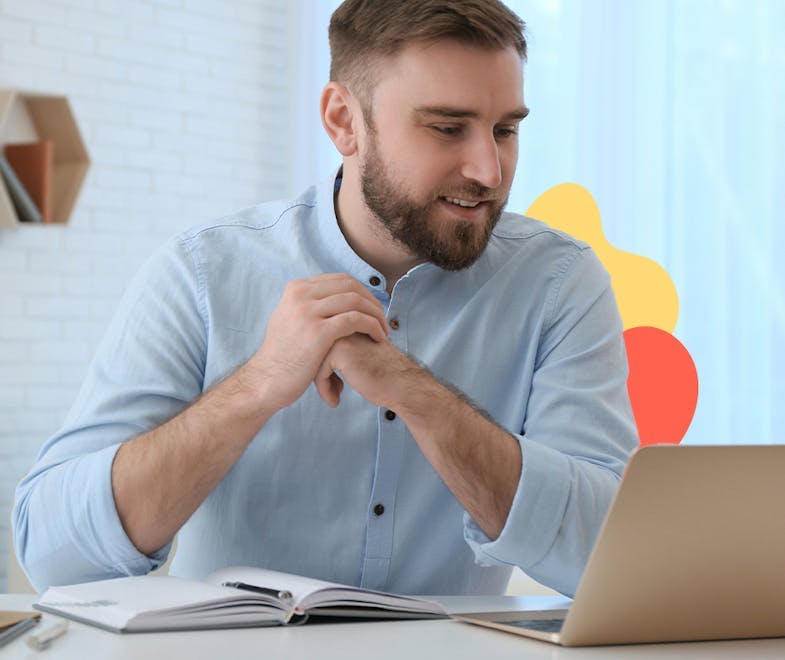 Young business man looking at his laptop