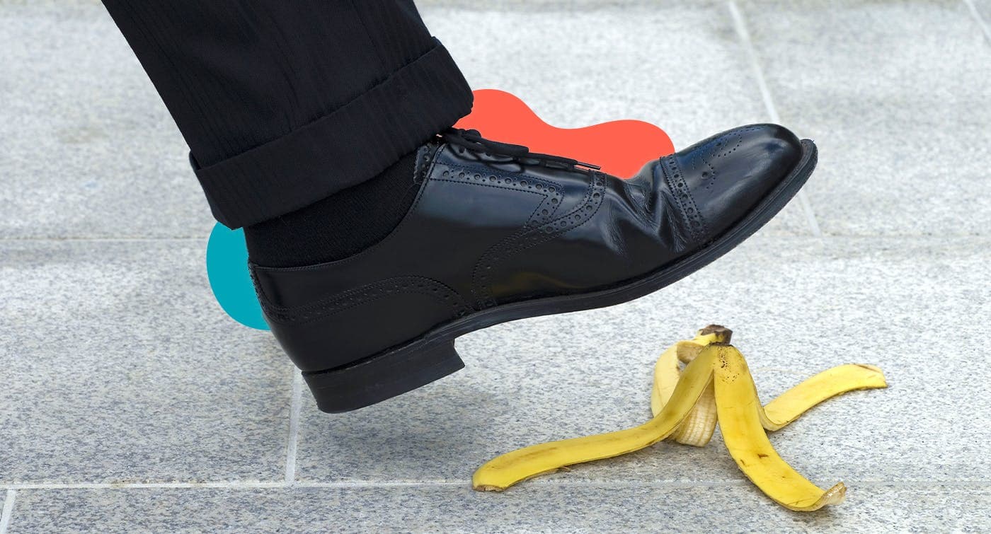 A shoe stepping on a banana peel to represent a mistake that could be costly